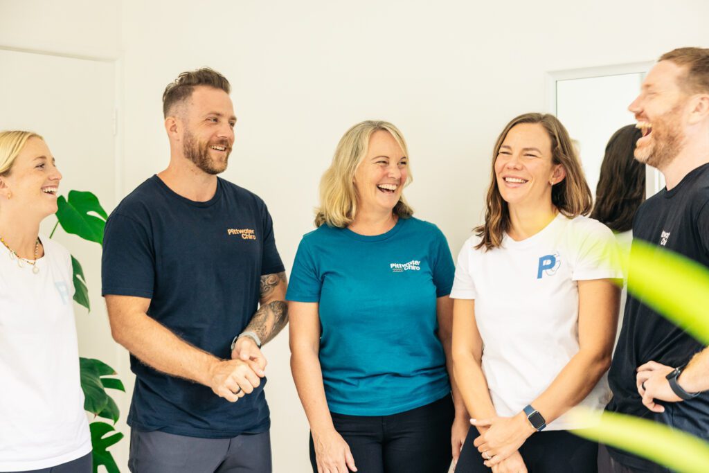 Five chiropractors discussing the new types of stretching