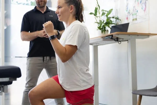 Chiropractor teaching patient how to lunge correctly Balgowlah and Mona Vale